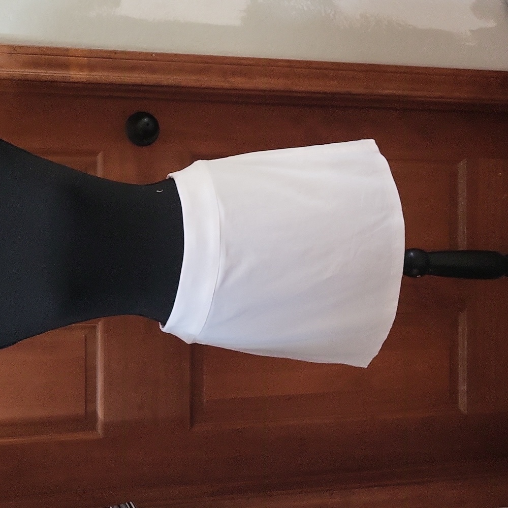 White tennis skirt with pleats in the back of skirt.